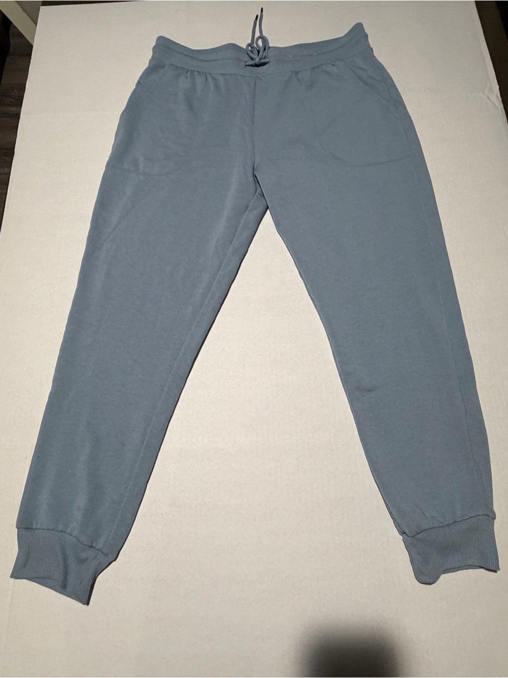 stars above muted blue fleece sweatpants
